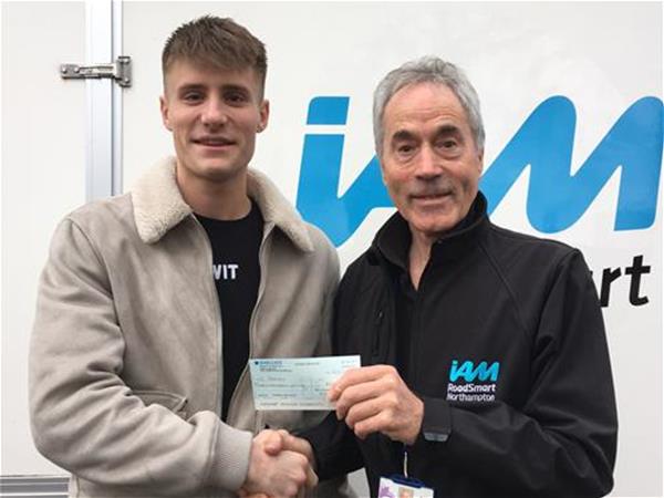 Christian Rodley with our Chair John Norrie, receiving his £100 cash back